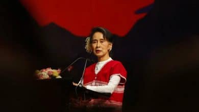 Photo of Suu Kyi retains power