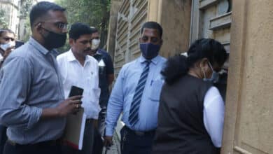 Photo of Narcotics Control Bureau (NCB) officials at Shah Rukh Khan’s house Mannat