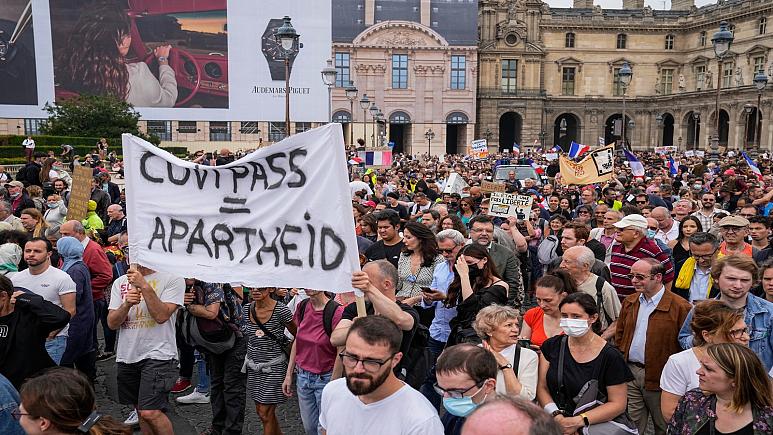 Tens of thousands rally against Covid curbs in Europe and Australia