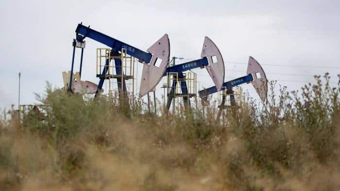 Oil prices drop more than 10% as virus variant threatens blow to demand