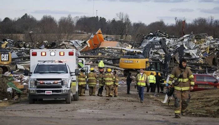 The powerful storm system that devastated parts of the United States overnight is likely to be "one of the largest tornado outbreaks in our history," President Joe Biden said Saturday. "It's a tragedy. And we still don't know how many lives are lost and the full extent of the damage," he said in televised comments. At least 78 people were killed, with more than 70 of them in Kentucky alone, after the series of tornadoes roared across five states, leaving post-apocalyptic scenes of devastation. There are fears the toll will rise. "Whatever is needed, I'm going to ask for," Biden vowed at his press conference. When asked whether climate change had impacted the storms, he said he "can't say" and that he would ask the government's Environmental Protection Agency to look into the question. "But the fact is that we all know everything is more intense when the climate is warming, everything," Biden continued. "And obviously it has some impact here but I can't give you a quantitative read on that." He promised to visit the damaged region, but said he wanted to be sure he did not get "in the way of rescue and recovery." "But I ... will plan on going," he said.