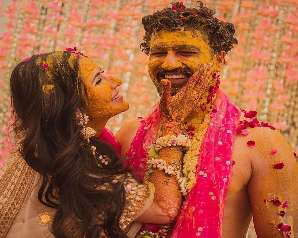 Bollywood lovebirds Vicky Kaushal and Katrina Kaif have treated their fans with a glimpse from their haldi celebrations.A Katrina on Saturday shared a string of pictures on Instagram. The actress is covered in haldi (turmeric) and is all smiles as she poses with her hubby Vicky. Vicky too shared a few pictures, which features his father putting haldi on him, posing with Katrina and his groom squad putting water on him. For the caption, the two wrote: "Shukr. Sabr. Khushi." Katrina and Vicky tied the knot on Thursday in an intimate but lavish wedding in the Six Senses Fort Barwara Hotel, Sawai Madhopur, Rajasthan, with friends and family in attendance. Katrina wore a bridal lehenga crafted by ace designer Sabyasachi Mukherjee for her special day, Vicky is said to have worn a beige sherwani after his 'sehrabandi'. The couple also made it official that they would soon host a reception in Mumbai for those who were not invited to the very private marriage ceremony at Sawai Madhopur.