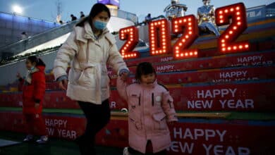 Photo of New Year’s eve muted by Omicron;  many hoping for better 2022