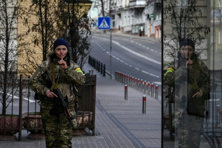 Guns, blasts and smiles in Kyiv under military curfew