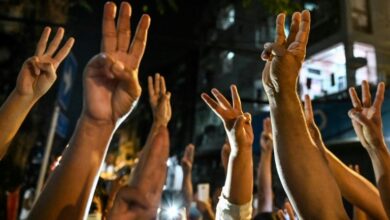 Photo of Myanmar protesters defy junta with strike and clapping protests on coup anniversary
