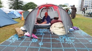 Photo of Cyclone, cheesy pop, fails to dislodge New Zealand anti-vaccine protesters