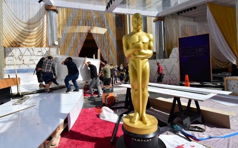 Oscars back in Hollywood as 'CODA' seeks top prize
