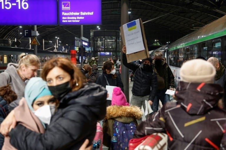 Tired and emotional, Ukrainians arrive by train in Berlin