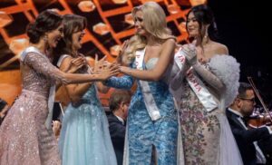 Bielawska is greeted by fellow participants after winning the 70th Miss World beauty pageant. Credit: AFP Photo