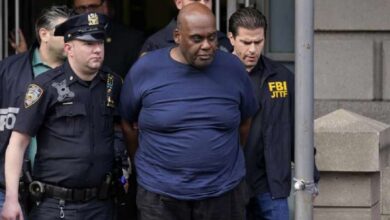 Photo of Brooklyn subway shooting suspect in custody, but motive remains unclear