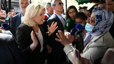 Photo of Macron clashes with Le Pen over Islamic headscarf ban