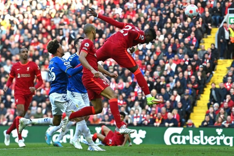 Liverpool overcome Everton battle to keep pressure on Man City