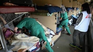 Photo of Speeding west, Ukraine hospital train ferries patients to safety