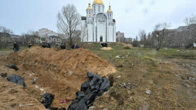 Photo of Bucha mourns at mass graves in wreck of Russian retreat