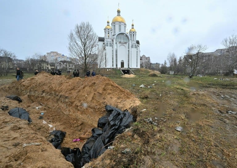 Bucha mourns at mass graves in wreck of Russian retreat