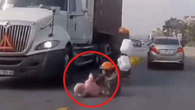 Photo of Watch: Mother saves child from being run over by truck using her quick reflexes