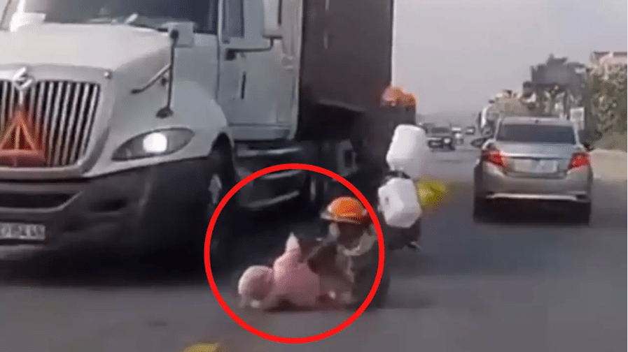 Watch: Mother saves child from being run over by truck using her quick reflexes