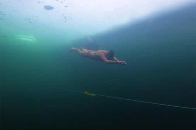 Woman swims nearly 300 feet under ice for Guinness World Record