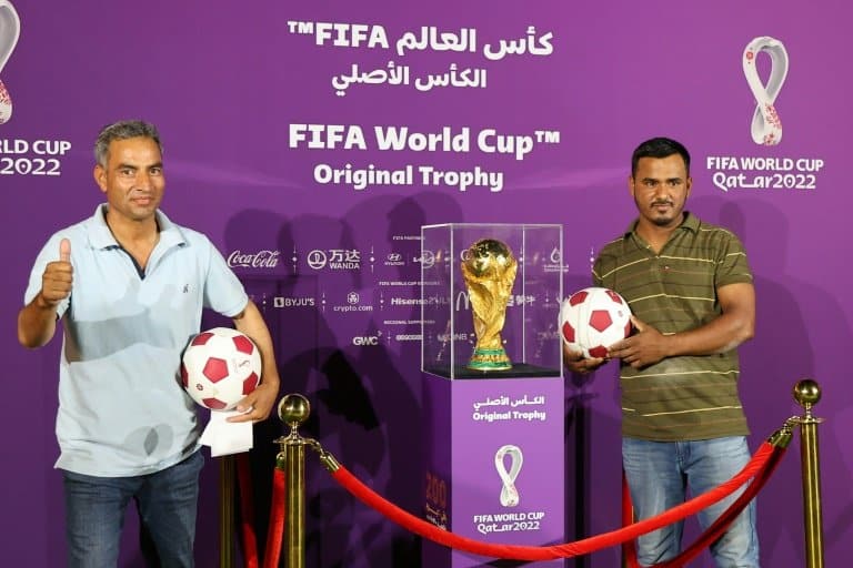 Qatar's migrant army queues for glimpse of World Cup