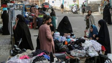 Photo of Afghan women defiant but feel ‘imprisoned’ by order to cover faces