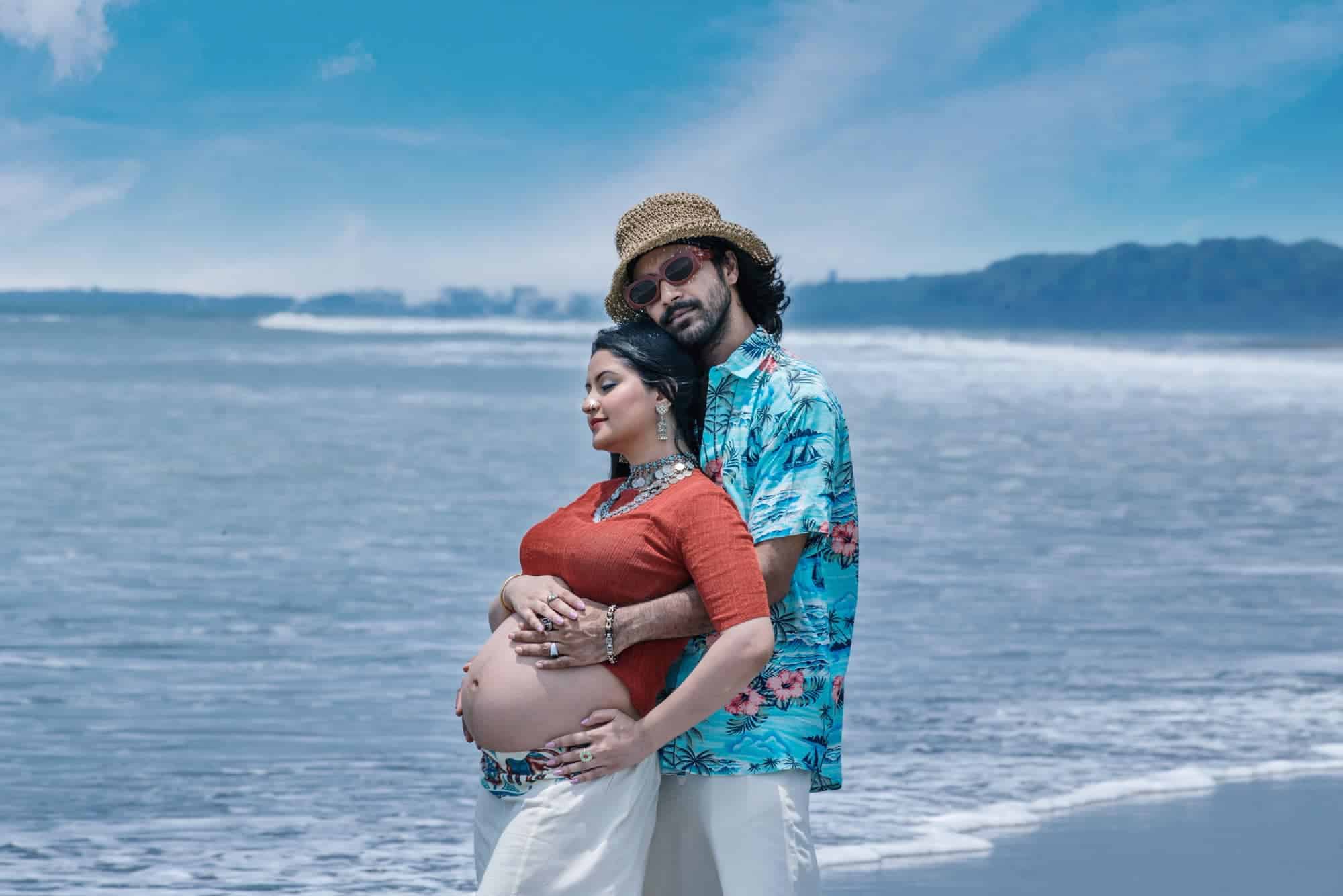 Pori Moni shows her open baby bump in maternity photoshoot at Cox Bazar Sea beach.