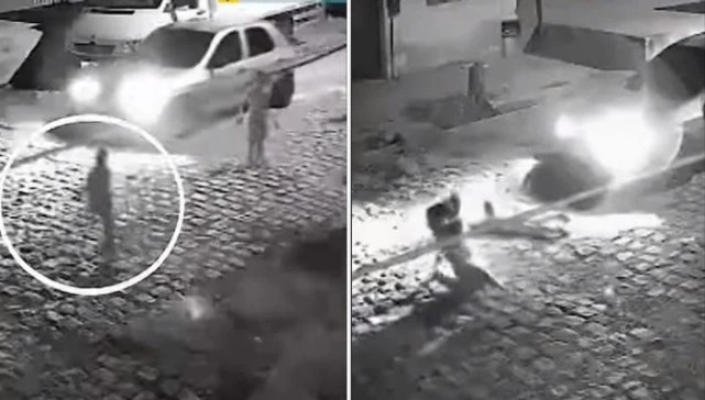 Watch: Mother jumps in front of speeding car to rescue son