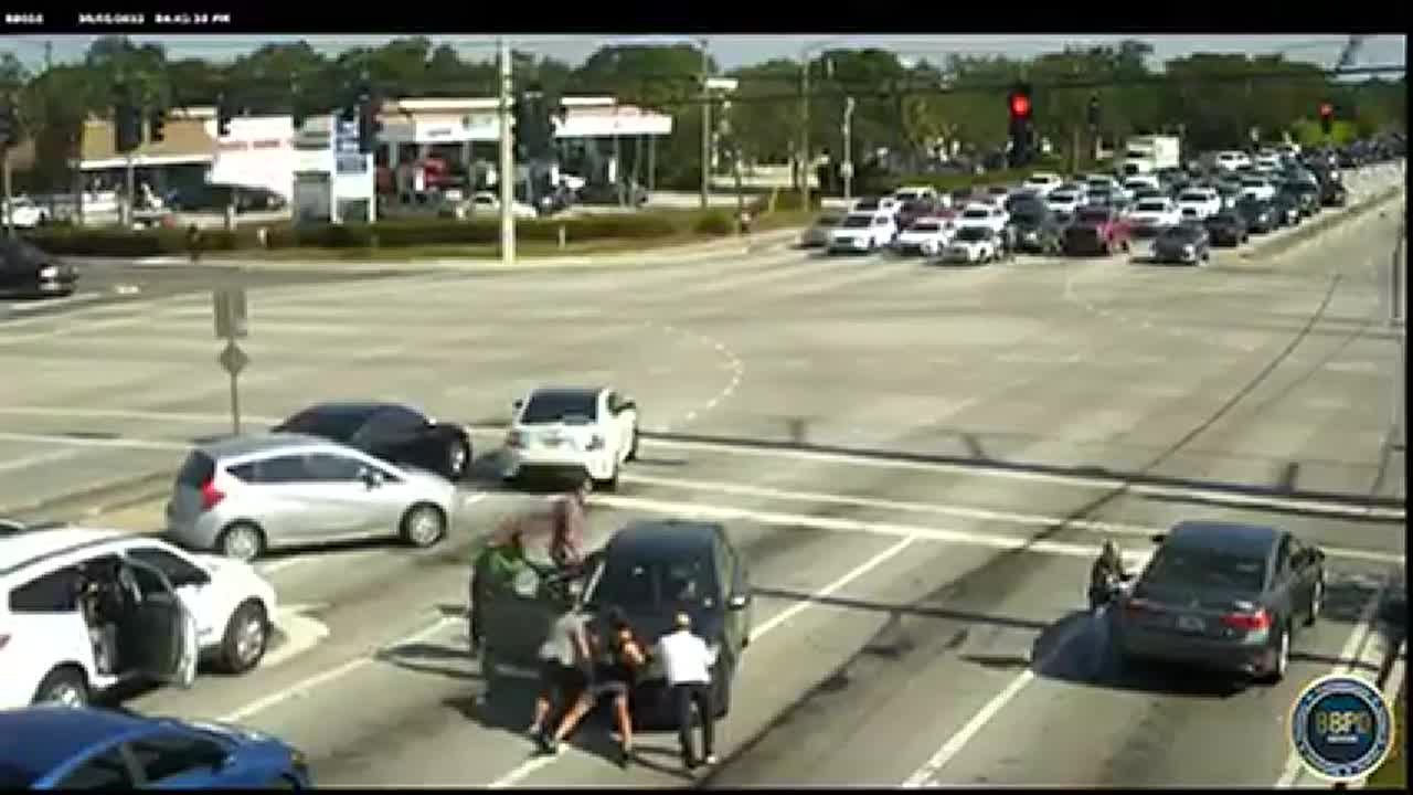 Watch: People stop car to save woman suffering medical episode