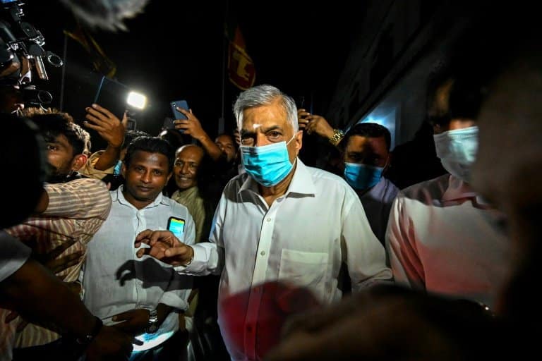 Sri Lanka's new PM struggles to form unity government