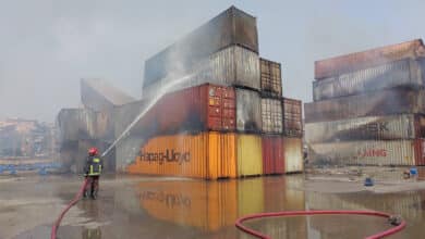 Photo of Firemen continue to work to douse depot fire completely