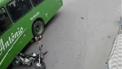 Photo of Brazilian biker slides under bus, comes out alive
