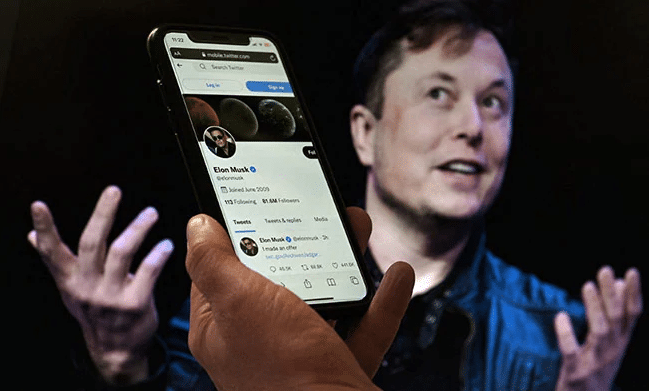 Elon Musk reacts after Twitter sues him