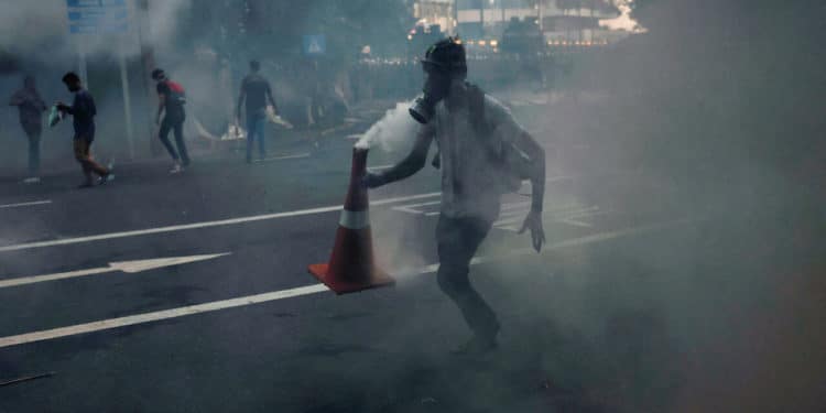 Sri Lanka imposes curfew as cops fire tear gas at protesters