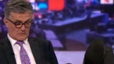 Photo of BBC anchor Tim Willcox caught off guard with feet on desk during live TV