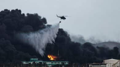 Photo of Firefighters, helicopters battle to contain Cuba fuel depot blaze