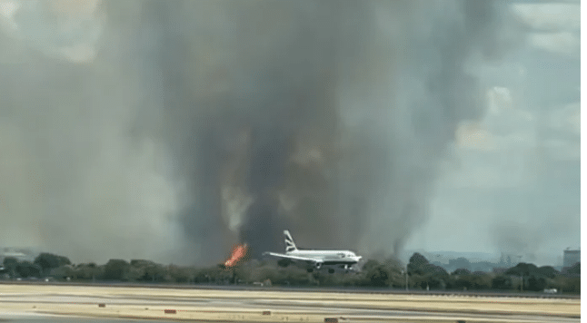Over 100 firefighters battle wildfire near British airport