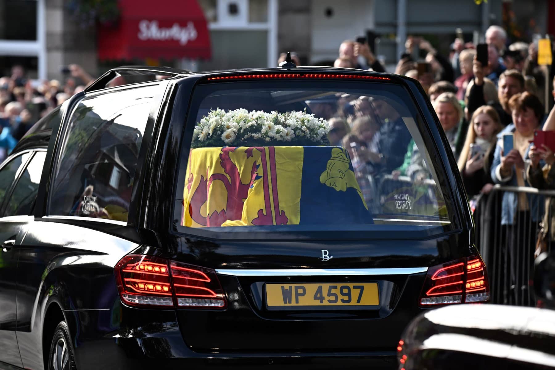 Queen Elizabeth II begins solemn final journey
