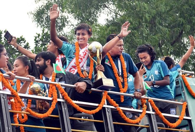 Victorious Bangladesh women's football team returns home