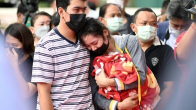 Photo of Distraught parents lay white roses for Thai nursery massacre victims