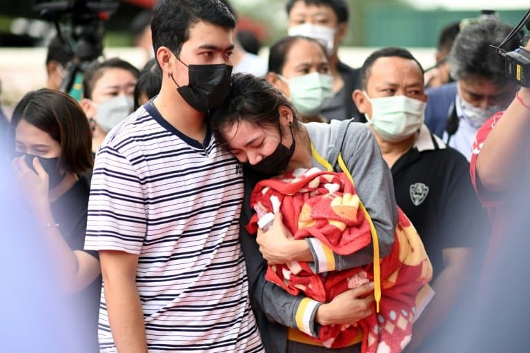 Distraught parents lay white roses for Thai nursery massacre victims