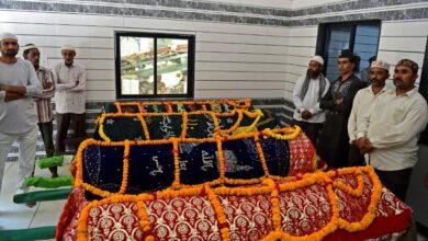 Photo of Families line up to bury dead from India bridge collapse