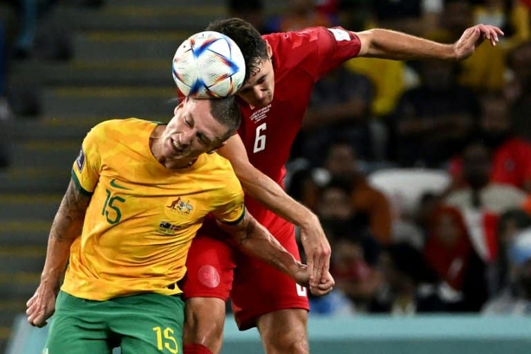 Australia reach World Cup last 16 and send Denmark home