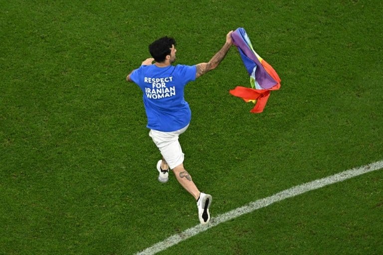 Man with rainbow flag invades pitch during World Cup match